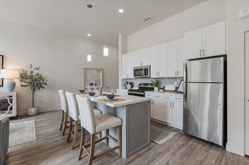 Kitchen with island and bar stools10